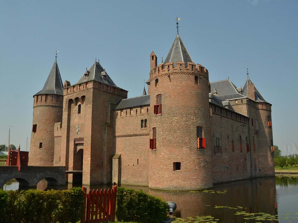 Medieval towers and moat of Muiderslot Castle near Amsterdam