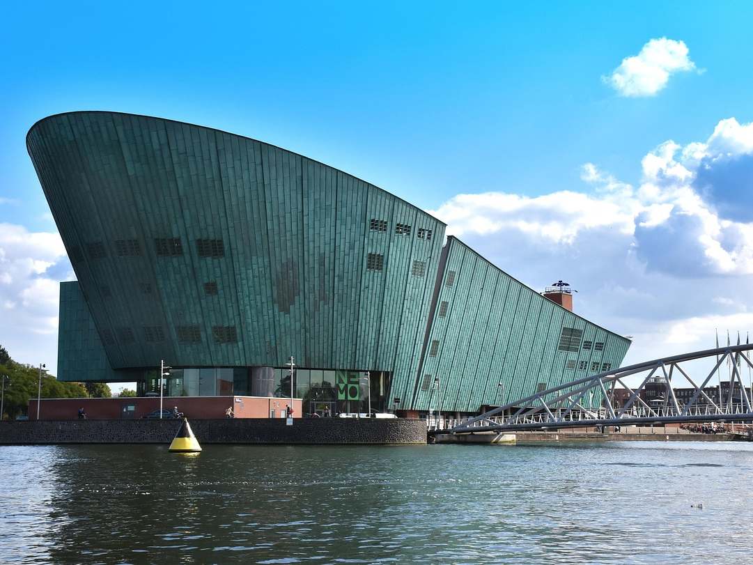 Copper-green NEMO Science Museum beside the water in Amsterdam