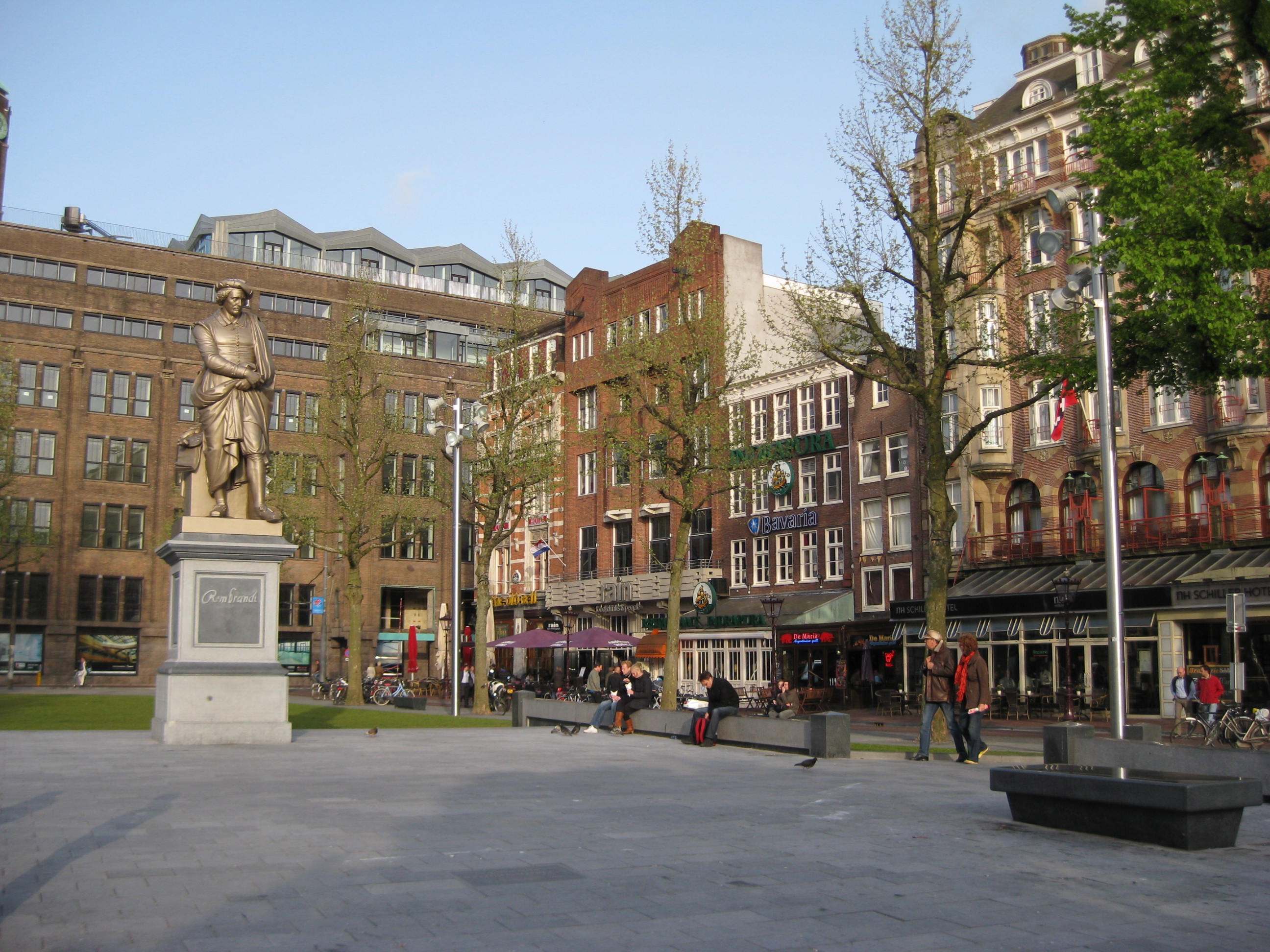 Rembrandtplein square with cafes and evening city life