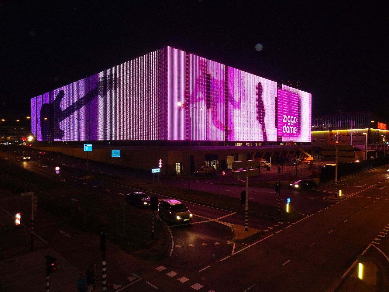 The Ziggo Dome's lit facade at night in Amsterdam Zuidoost