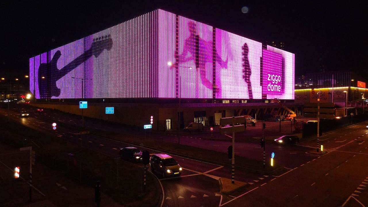 The Ziggo Dome's lit facade at night in Amsterdam Zuidoost