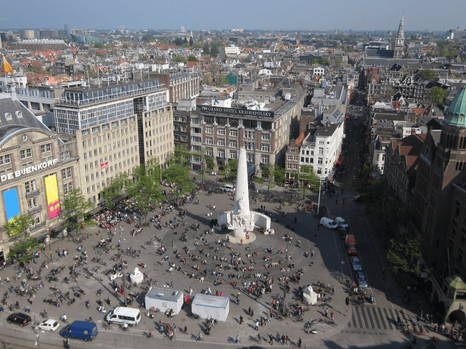 Landmark buildings and visitors on Dam Square Amsterdam